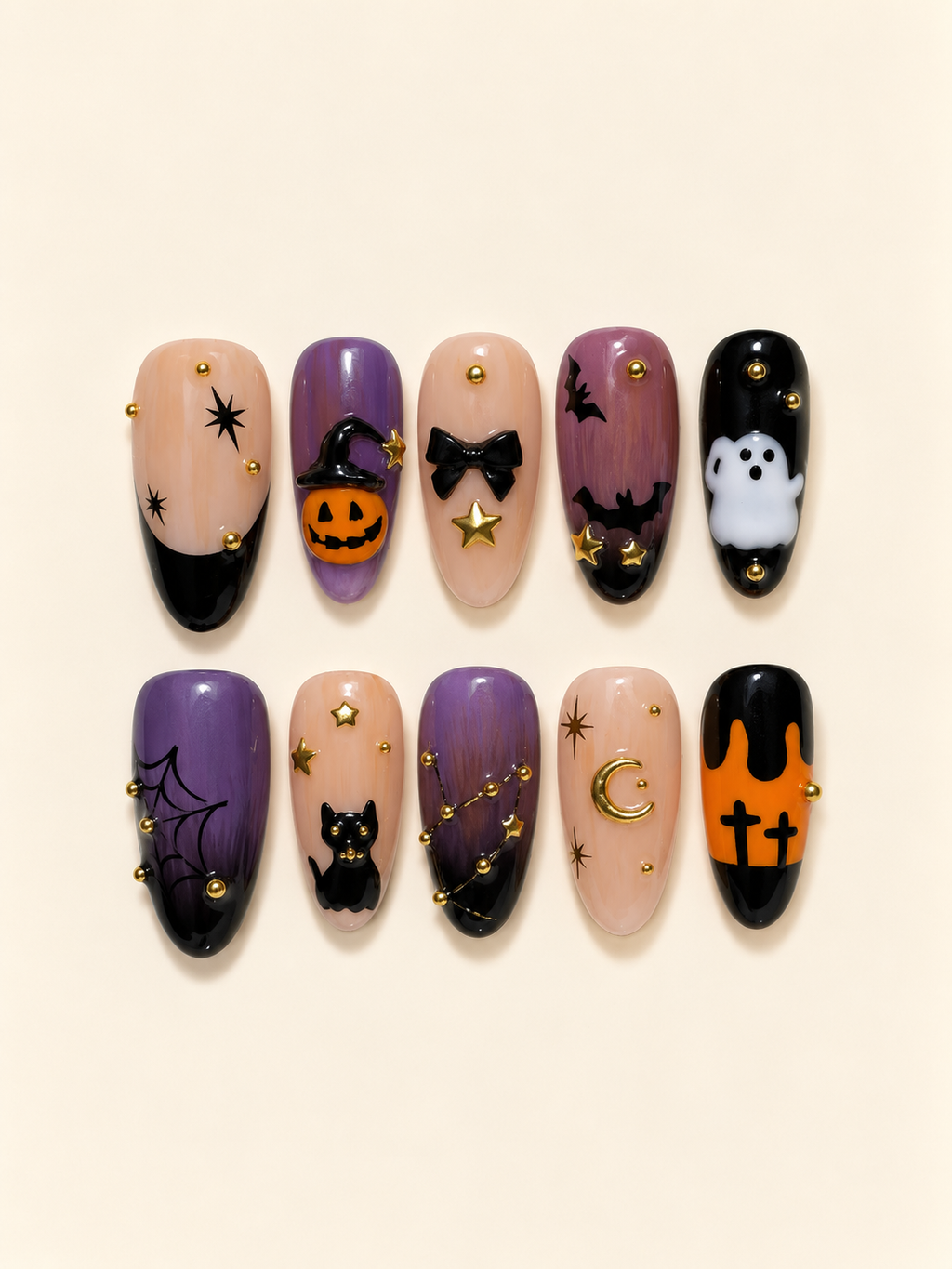 Ten Halloween almond press-on nails in purple, peach, orange, and black with a pumpkin, ghost, black cat, bats, spiderweb, and gold accents
