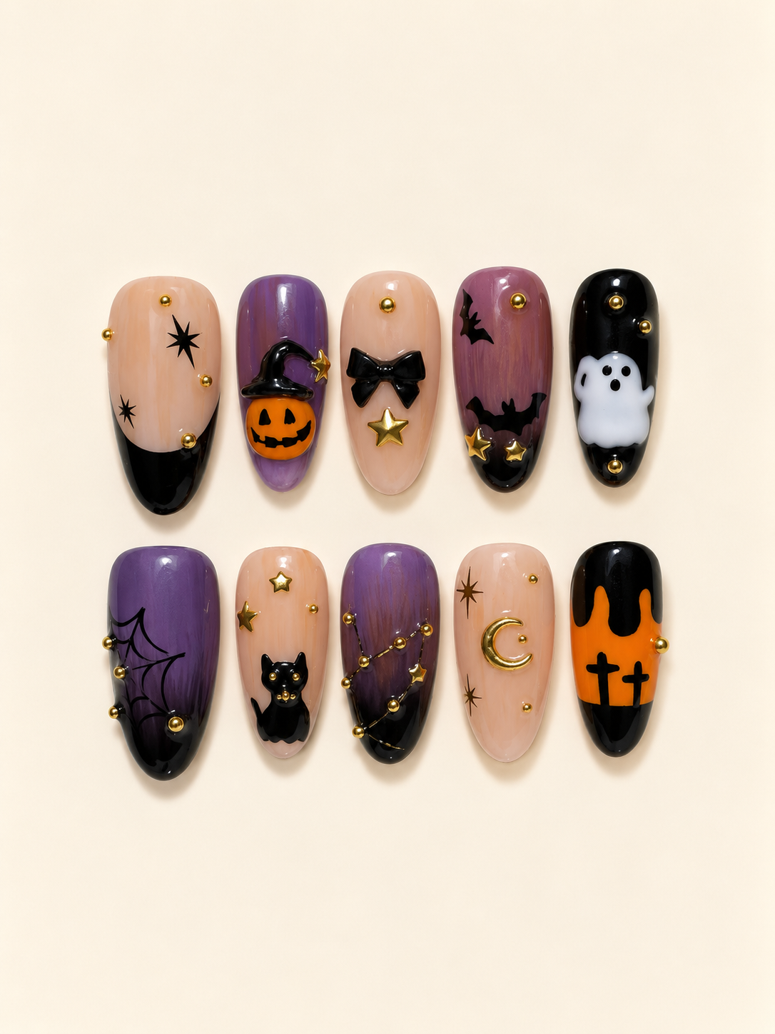Ten Halloween almond press-on nails in purple, peach, orange, and black with a pumpkin, ghost, black cat, bats, spiderweb, and gold accents