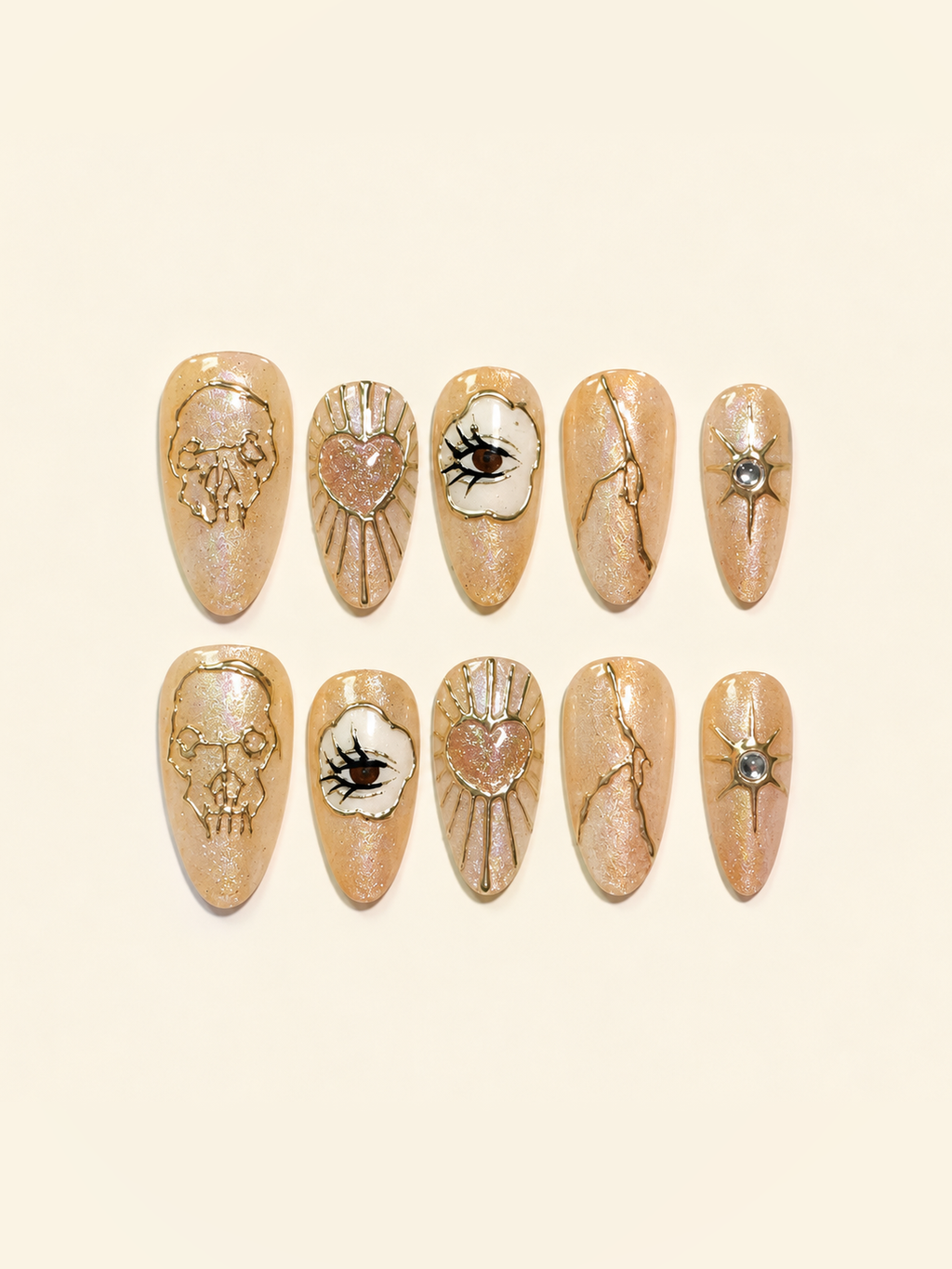 OVANA peach-gold Halloween press-on nails with sculpted skull, eye, heart, and star motifs