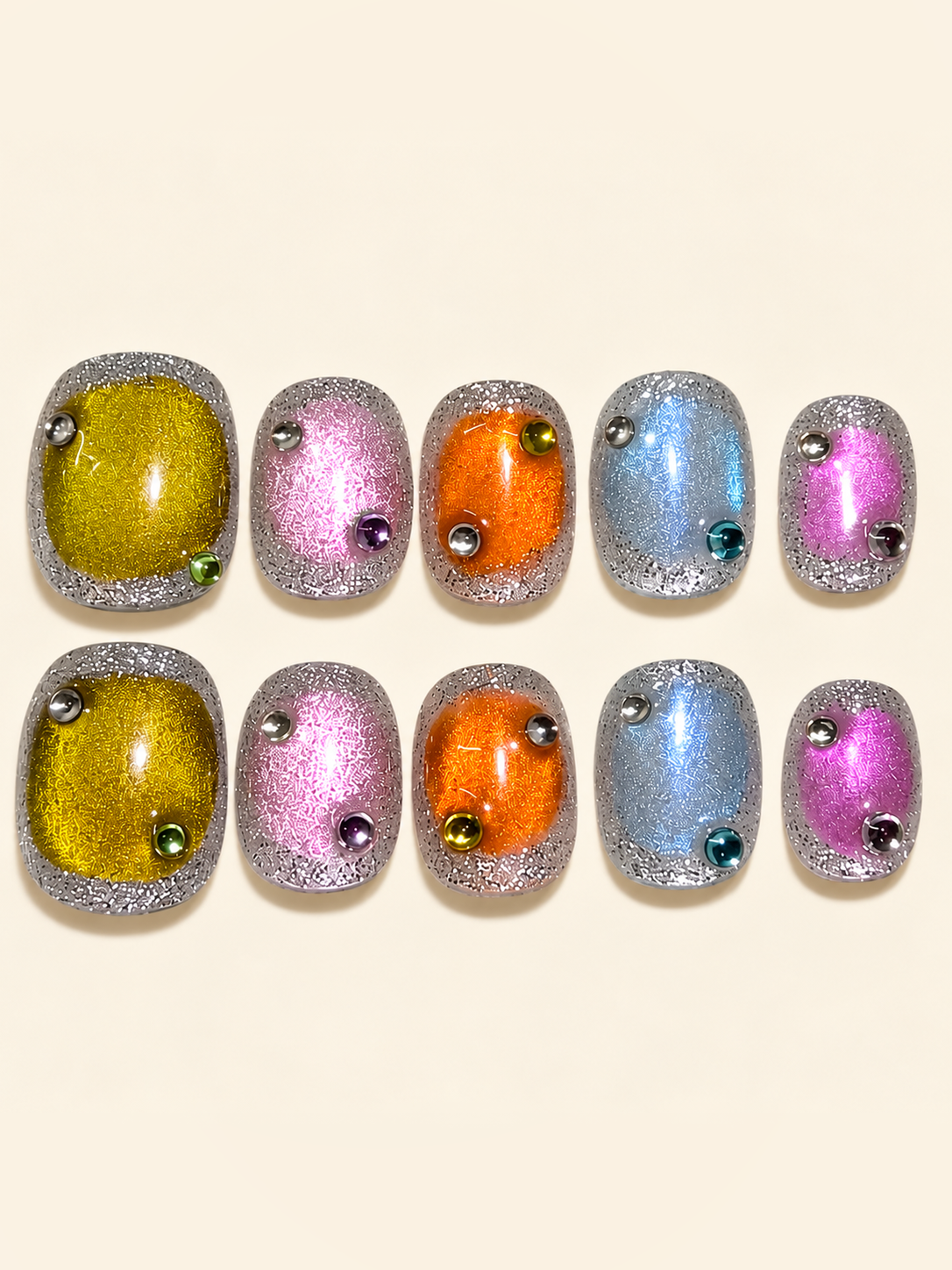 OVANA multicolor cat-eye press-on nails with silver glitter borders and jewel accents