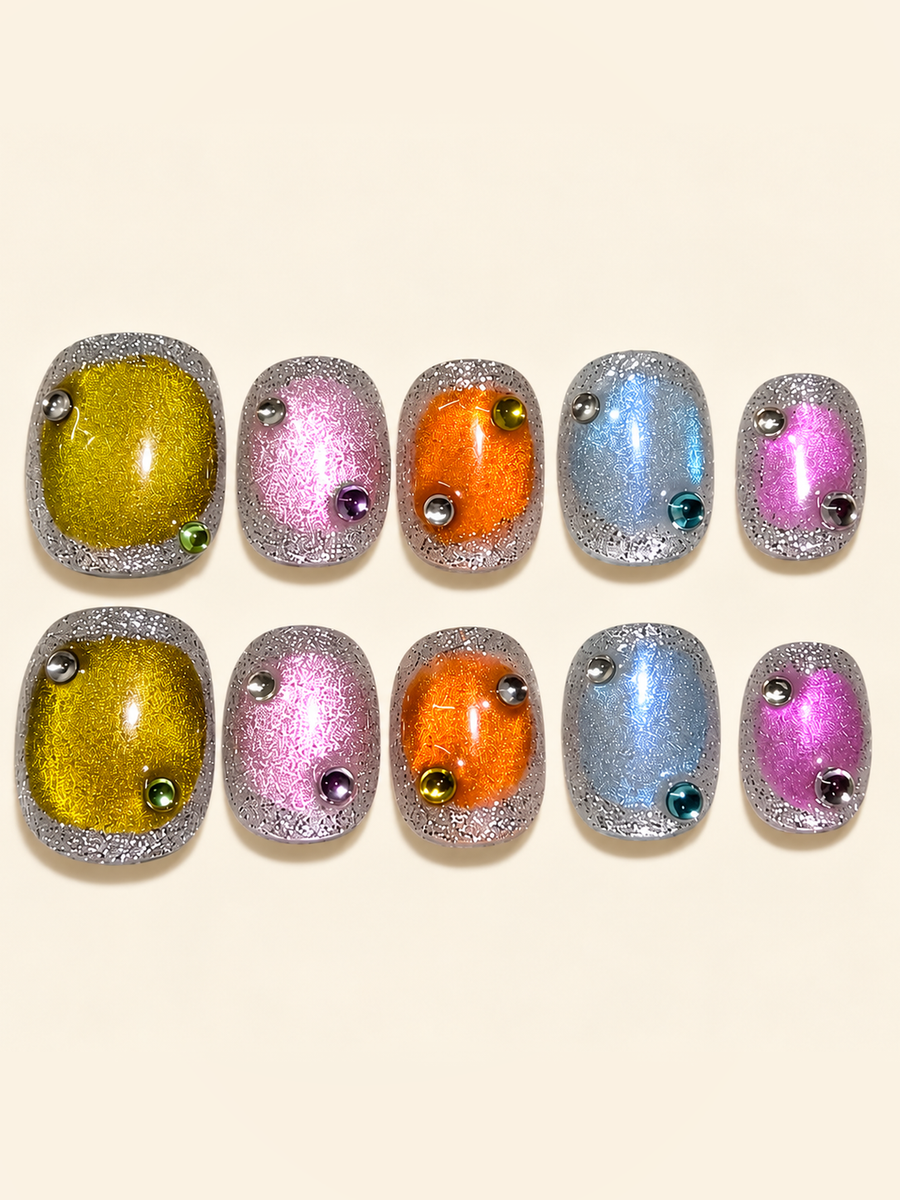 OVANA multicolor cat-eye press-on nails with silver glitter borders and jewel accents