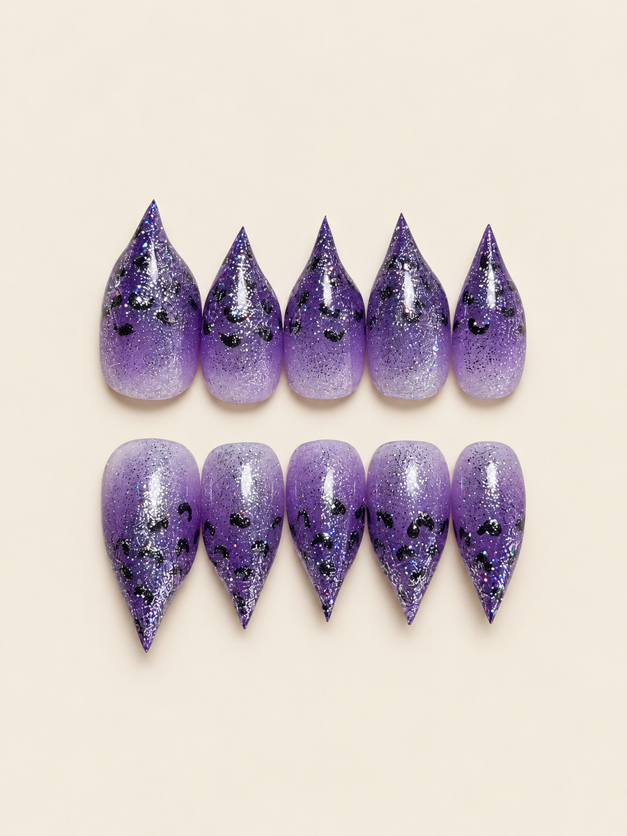 Purple glitter ombré stiletto press-on nails with black leopard print spots